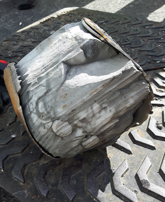 Drain-and-sewer-obstruction-removal-close-up-of-cut-out-steel-pile.png