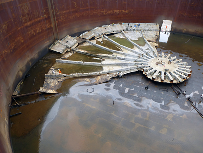 RGL-cutting-through-pieces-of-collapsed-steel-tank-roof.png